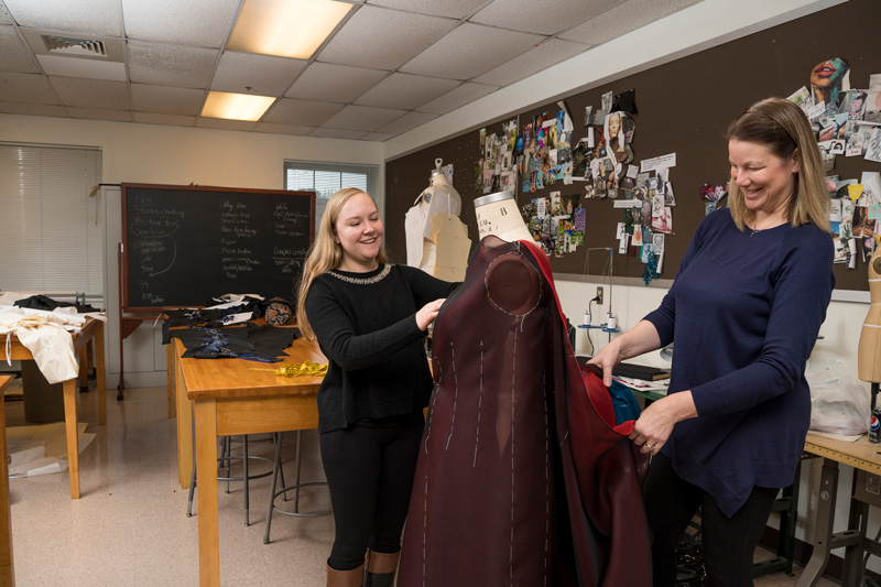 Belinda Orzada (shoulder length blonde hair, blue shirt) along with colleague M. Jo Kallal (orange sweater) and students Cheyenne Smith and Mikayla DuBreuil are working on the costumes that Xiang Gao and his musicians will wear during their performance up at Carnegie Hall. (Releases were obtained on anyone pictured.)