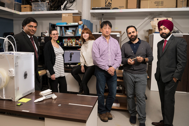 Doctoral student Ahad Benboodi and his mentor Dr. Samuel Lee along with colleagues Martha Hall (red hair), Prabhpreet Gill (red habib), Elisa Arch (pregnant gal) are all working on designing a shoe for children with Cerebral Palsy. (Model releases obtained on all participants.)