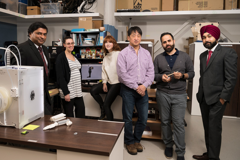 QED Science Center Grant Doctoral student Ahad Benboodi and his mentor Dr. Samuel Lee along with colleagues Martha Hall (red hair), Prabhpreet Gill (red habib), Elisa Arch (pregnant gal) are all working on designing a shoe for children with Cerebral Palsy. (Model releases obtained on all participants.)