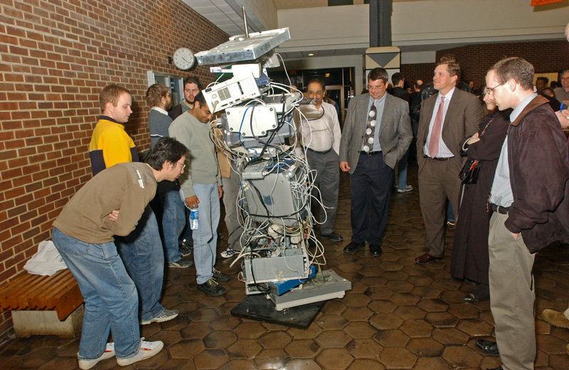 The Inaugural Exhibition of the U of D's new Computing Museum was held in the atrium of Smith Hall  SHOWN - Attendees inspect the sculpture "Reconnect" by Ron Longsdorf