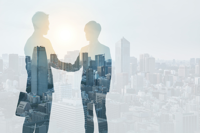 904426582 Marketing communication concept. Silhouette of business persons shaking hands.