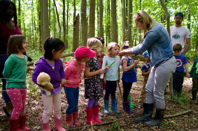 Children watering the edible flower garden at the UD Early Childhood Center. Photos by Eric Rush. Photo releases obtained by Eric Rush.