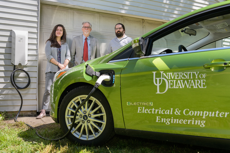 Willett Kempton, a Professor in the School of Marine Science and Policy; Rodney McGee, a limited term researcher in Electrical Engineering; and Sara Parkison, a graduate student in the College of Earth; Ocean; and Environment. are UD’s principal V2G (Vehicle to Grid) team and have been working to advance the technology, adoption, and policies of grid-integrated vehicles in Delaware and globally. Recently, the team was able to celebrate Delaware’s legislature sending Senate Bill 12 to the Governor for his signature. The bill “facilitates electric vehicle and grid-integrated electric vehicle interconnection” [https://legis.delaware.gov/BillDetail/37113]. - (Evan Krape / University of Delaware)
