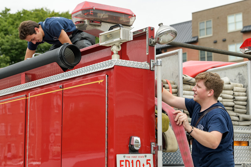 Several students from the University of Delaware volunteer with Aetna Hose, Hook, & Ladder Company as firefighters and Emergency Medical Technicians (EMTs). Photographed for a story in UDaily about their work with Aetna as first responders. - (Evan Krape / University of Delaware)