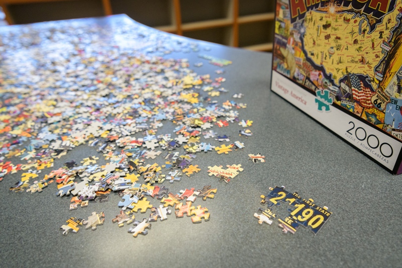 Puzzles at Morris Library at the Periodicals and Reference desk for students to put together when they need a break from their studying for finals. Photographed for a UDaily article about “de-stressing” during finals week. - (Evan Krape / University of Delaware)