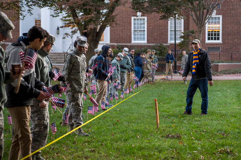2019 Flag planting for Veterans Day, November 5th, 2019. Jason Wardrup from the Blue Hen Veterans leads a group of students in planting the flags.  