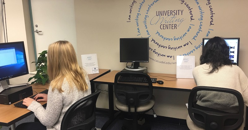 Students sitting at Writing Center computers