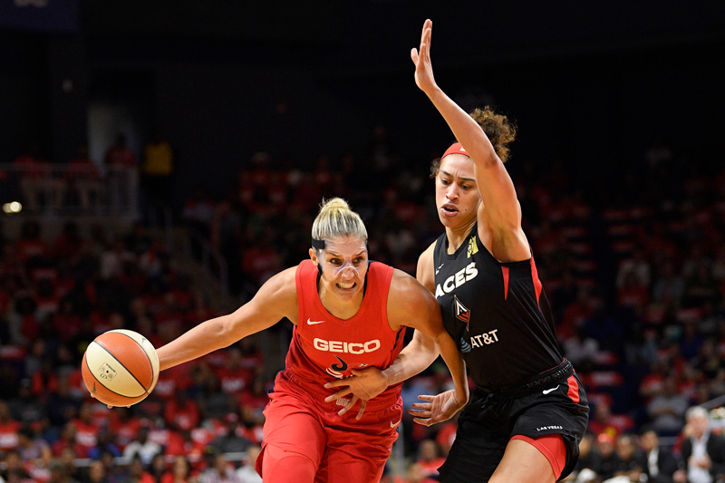 Washington Mystics forward Elena Delle Donne, left, drives to the basket against Las Vegas Aces forward Dearica Hamby during the first half of Game 1 of a WNBA playoff basketball series Tuesday, Sept. 17, 2019, in Washington. (AP Photo/Nick Wass)