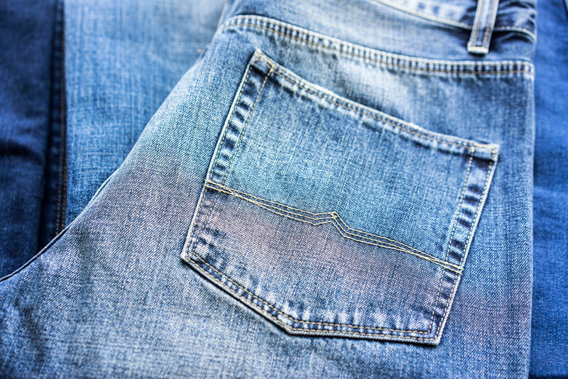 1050492996 Back pocket stitch detail on women's jeans