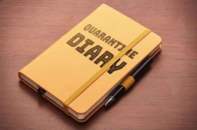 1216561965 copybook with "Quarantine Diary" as a title. *** The text was digitally superimposed and a release is provided ***