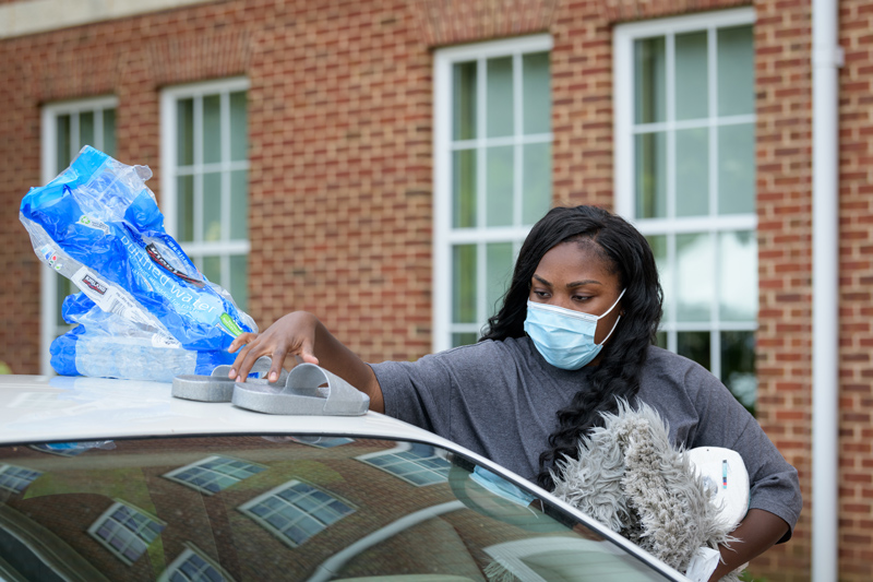 UD's first day of a new, multi-day staggered move-in designed to accommodate the social distancing and health considerations required to safely bring students back to school amidst the COVID-19 pandemic. Only about 1,300 students will be returning to living in on-campus housing and their move-in has been spread across 5 days.

Pictured: First year student Di'Asha Harry moves in to Independence Hall