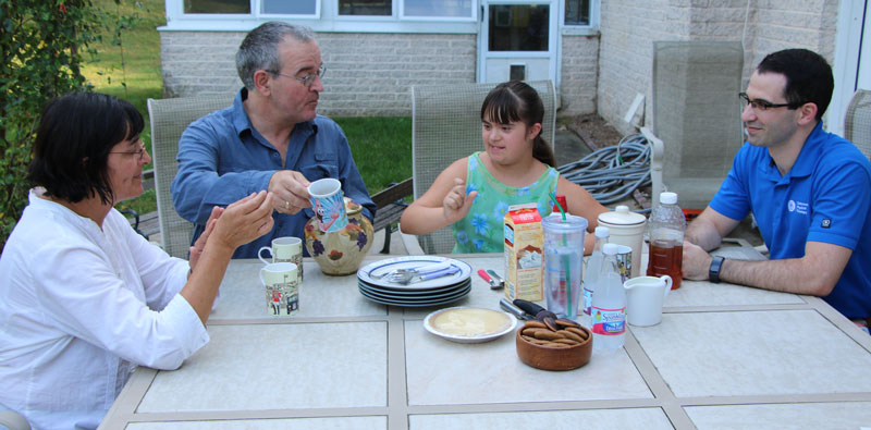 Family with student from LEND program LEND trainees are matched with a family and embedded in their lives. David Cavagnino is pictured here with the Cole family.