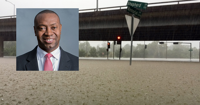 Heavy rain pouring down and flooding a major intersection during Hurricane Harvey.