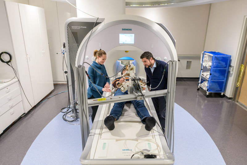 COE-BMEG-Sergi_fMRI_Research-020420 Fabrizio Sergi, assistant professor of Biomedical Engineering and director of the Human Robotics (HuRo) lab, has received an NSF Faculty Early Career Development (CAREER) award. Along with current Ph.D. students Andrea Zonnino and Andria Farrens, Sergio has been using robotics and haptic feedback systems with neuroimaging - particularly Functional Magnetic Resonance Imaging (fMRI) - to study the neural substrates of motor control.