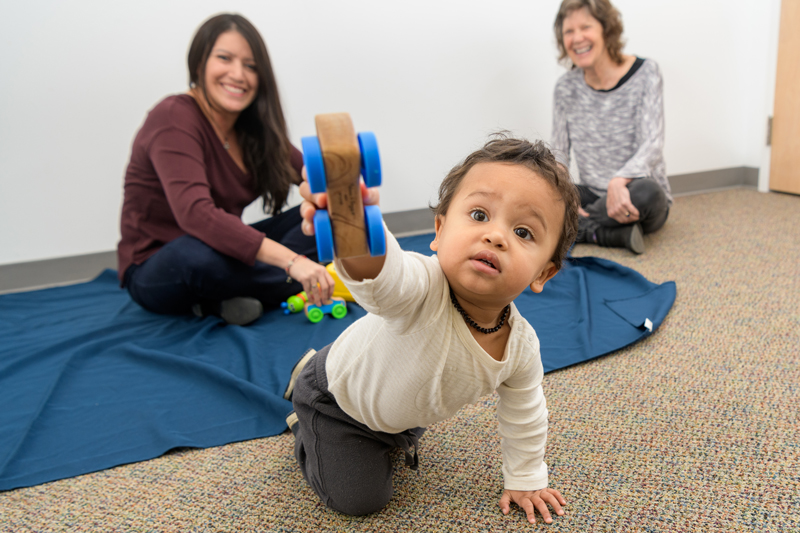 Photos of a child and family in Dr. Mary Dozier's "Attachment and Biobehavioral Catch-up (ABC)" lab where she does research into enhancing "children’s ability to regulate behavior, emotions, and physiology" [Lab Website]