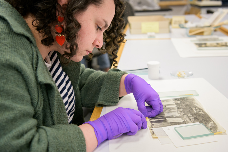 First year fellows (master's students) with the Winterthur / University of Delaware Program in Art Conservation (WUDPAC) program work on conserving "a group of 85 photos of Puerto Rican boxers that came from The House of the Boxer, a nonprofit organization based in Puerto Rico that celebrates the island's rich tradition in the sport of boxing." [UDaily]

Pictured (from left): Abigail Rodriguez