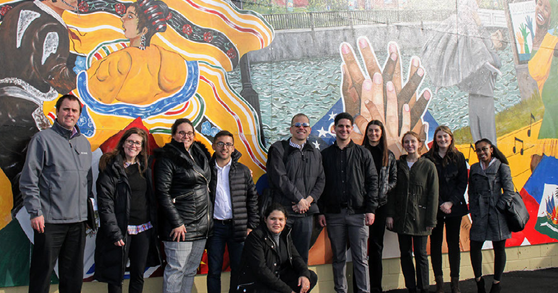 Students standing in front of mural in Milford, Delaware