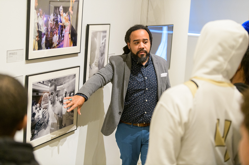 CEHD-HDFS-Carey-Black_Boys_Matter-Art_Museum-011620 Roderick Carey, Assistant Professor of Human Development and Family Sciences, has a one year grant from the UD Partnership for Public Education (PPE) for a research project at Newark High School called "The Black Boy Mattering Project". Since October, he has worked with two doctoral students and a researcher from the Center for Research in Education and Social Policy (CRESP) interviewing approximately a dozen boys regarding how they matter to themselves, their peers, communities, families and school. The program has also included field trips, such as the one shown to the Delaware Art Museum for the students to see and respond to an exhibit titled "Posing: Beauty in African American Culture."