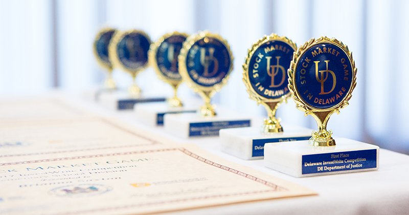 2018 Stock Market Game Awards Table covered with Stock Market Game Awards.