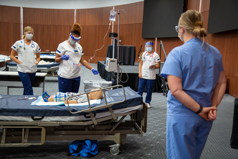 CHS-Nursing_Skills-090420 Megan Roth, UD Nursing alumna and new adjunct clinical instructor, leads a skills session in the audion of the Tower at STAR. The nursing students attending are preparing for their clinical placements.