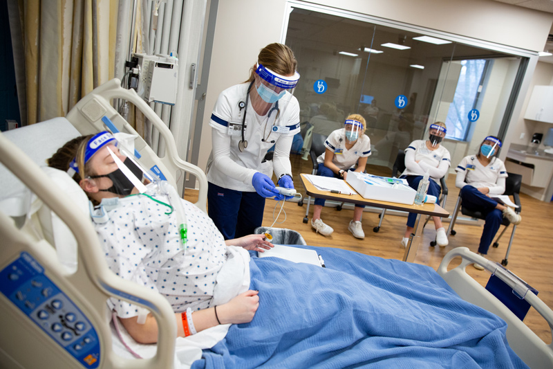 CHS-SON_Sim_Trach-030421 McDowell’s newly renovated simulation space in action during a class where nursing students rotated taking care of tracheostomy patients.