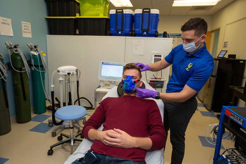 Chris Martens (right) utilizes blood testing on Houston Ward to analyze the effects of added sugar intake on brain blood flow and hippocampal function. 