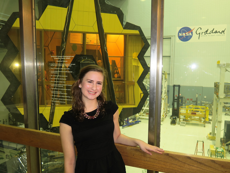 Elaine Stewart started working with the James Webb Space Telescope project as an intern when she was a sophomore at the University of Delaware. Here, she is standing outside the cleanroom where the telescope’s mirrors were housed during work at NASA’s Goddard Space Flight Center in Greenbelt, Maryland.