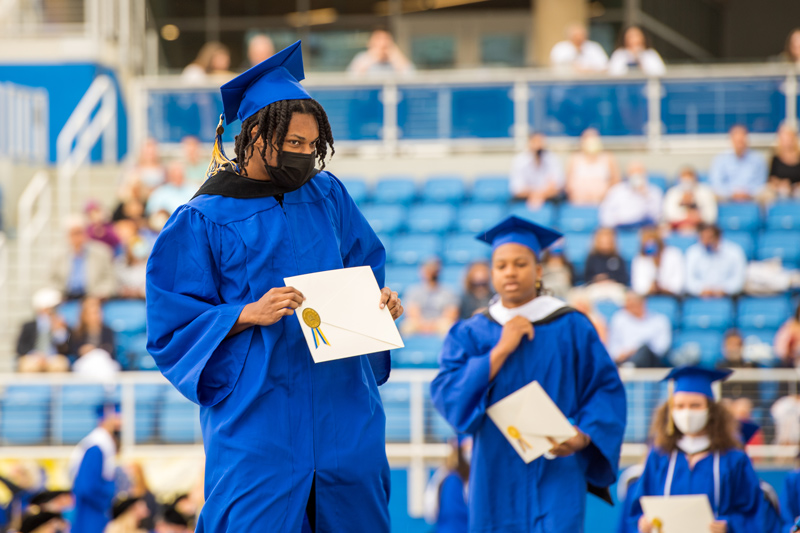 Commencement-CAS-KA-052821 The rain did not deter the graduates or the family and friends who came to watch the 2021 Commencement ceremonies.
