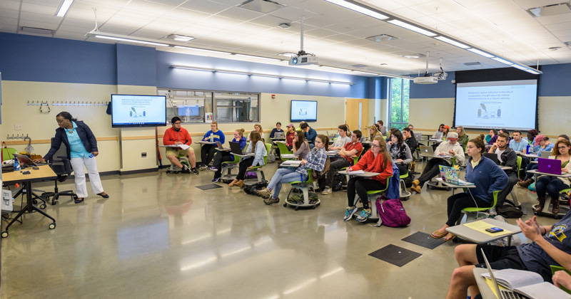 Students in the Harker Interdisciplinary Science and Engineering Laboratory working simultaneously in the adjacent lab / lecture spaces. - (Evan Krape / University of Delaware)