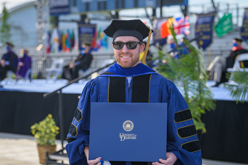 Hooding ceremony for 2020 and 2021 Doctoral Candidates, held on May 27th, 2021 in Delaware Stadium under the direction of UD President Dennis Assanis and Lou Rossi, Dean of the Graduate College and Vice Provost for Graduate and Professional Education.