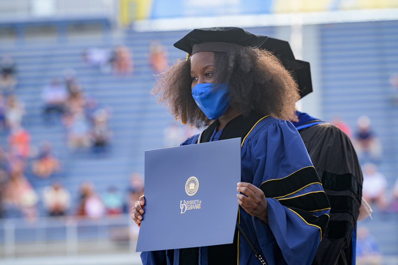 Hooding ceremony for 2020 and 2021 Doctoral Candidates, held on May 27th, 2021 in Delaware Stadium under the direction of UD President Dennis Assanis and Lou Rossi, Dean of the Graduate College and Vice Provost for Graduate and Professional Education.