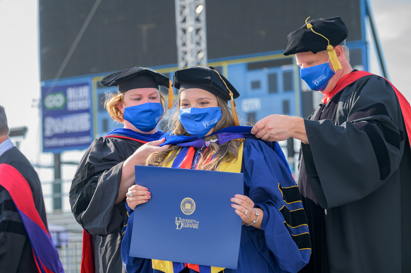 Hooding ceremony for 2020 and 2021 Doctoral Candidates, held on May 27th, 2021 in Delaware Stadium under the direction of UD President Dennis Assanis and Lou Rossi, Dean of the Graduate College and Vice Provost for Graduate and Professional Education.
