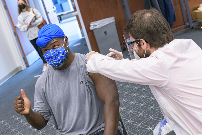 OCM-COVID-19-Higher_Ed_Vaccination_Clinic-040121 COVID-19 vaccination clinic held by Albertsons / Acme markets in the University of Delaware’s STAR Tower. Targeted specifically at specifically for employees and those affiliated with institutions of higher education in the state of Delaware.
Pictured Left: Carlton Cooper, Biological Sciences