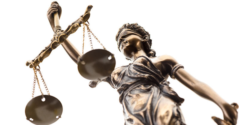 1182599229 Statue of justice isolated on white background