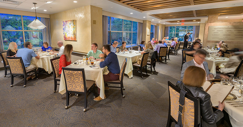 Patrons sit at socially distanced table during dinner service at Vita Nova.