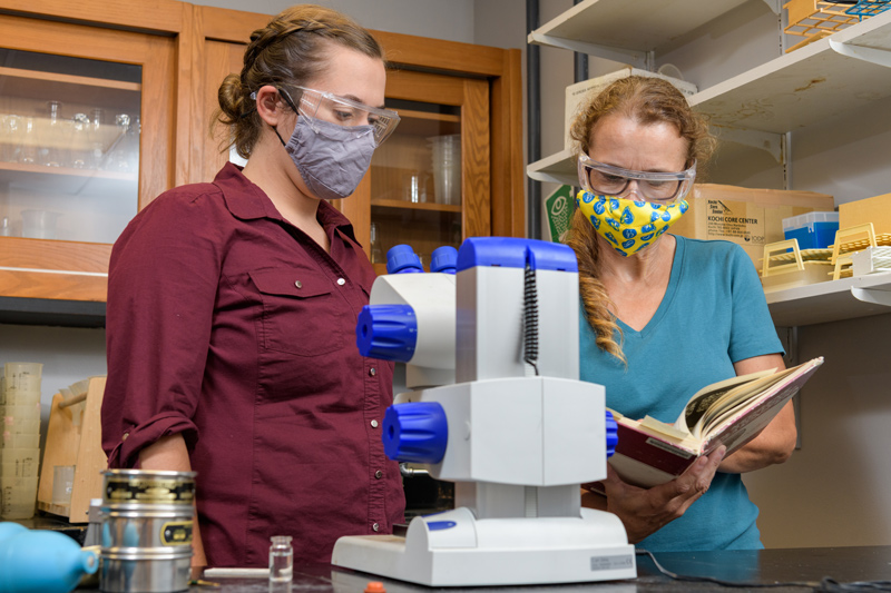 CEOE-SMSP-Leathrum_Erin-Summer_Research-Foraminifera-081321 Erin Leathrum (red shirt), a UD honors marine science major with an oceanography concentration, has been spending her summer conducting research in the lab of professor Katharina Billups. Erin has been doing research on microscopic organisms called foraminifera which live in the ocean in intricate shells of calcium carbonate the size of a small grain of sand. Over time, the foraminifers' shells become fossils, leaving a footprint of who once lived, and therefore the living conditions, in the overlying water.