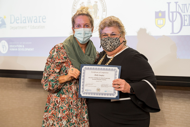 Holly Langley (left), assistant principal at Sussex Technical High School, receives her certification of completion from Jacquelyn Wilson, director of the Delaware Academy of School Leadership, after graduating from UD’s Governor’s Institute of School Leadership. Holly Langley (left), assistant principal at Sussex Technical High School, receives her certification of completion from Jacquelyn Wilson, director of the Delaware Academy of School Leadership, after graduating from UD’s Governor’s Institute of School Leadership.