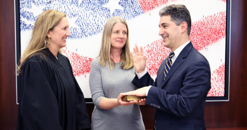 During a private ceremony at the National Courts Building in Washington, D.C., Leonard P. Stark was sworn in as a U.S. Judge for the Court of Appeals for the Federal Circuit. Chief Judge Kimberly A. Moore (left) administered the oath to Stark while he put his hand on a Lincoln Bible, which was held by his wife, Beth Stark.