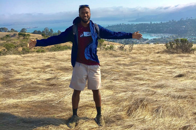 UD graduate Byron Riggins stands at the top of Old St. Hilary’s Open Space nature preserve in Belvedere, Tiburon in Marin County, California. The site is one of the best unencumbered views in the Bay area, offering a full 280 degrees of open view at the top of a small mountain.