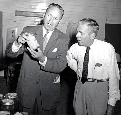 George Worrilow looking at a specimen