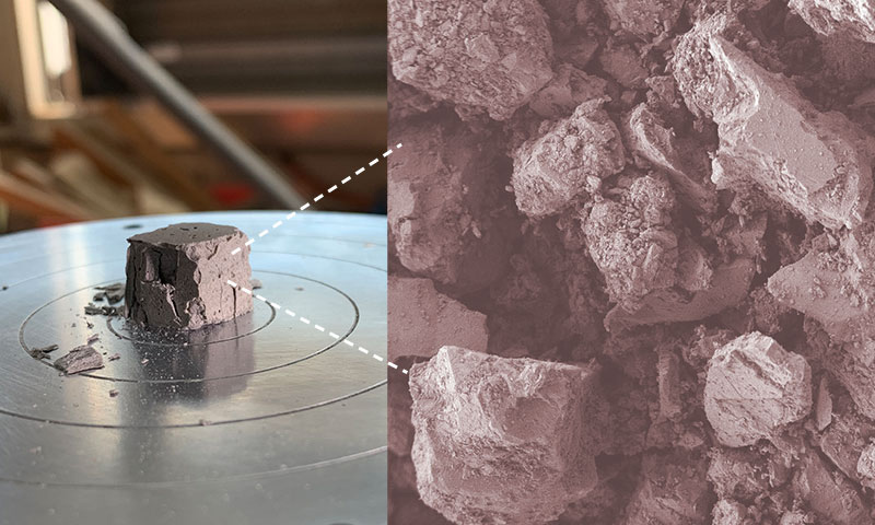 A crushed geopolymer cube made from simulated lunar topsoil, inset shows magnification of lunar topsoil particles which have been activated and reacted to form the geopolymer binder.