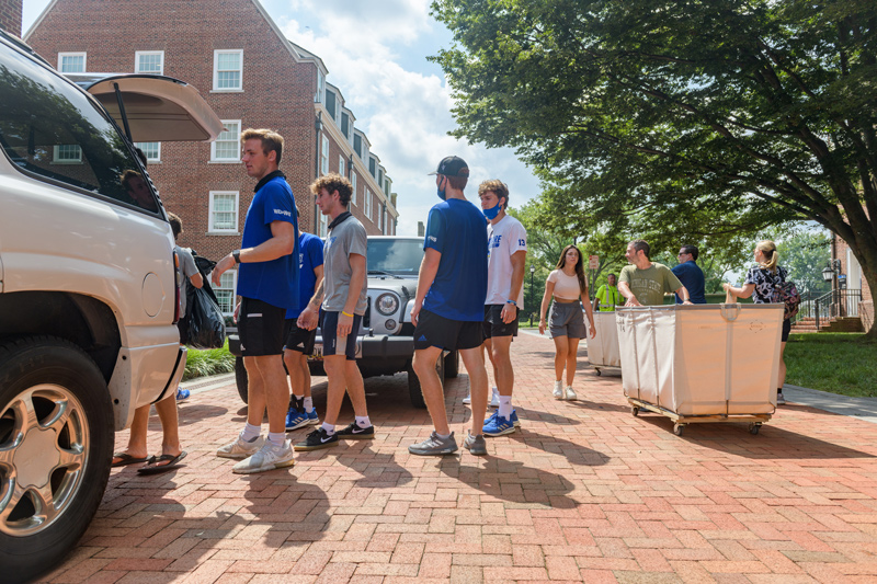 Most first-year students at the University of Delaware are scheduled to move into residence halls on Saturday, Aug. 27. As in this photo from 2021, students and families will be assisted by Blue Hen Helpers. 