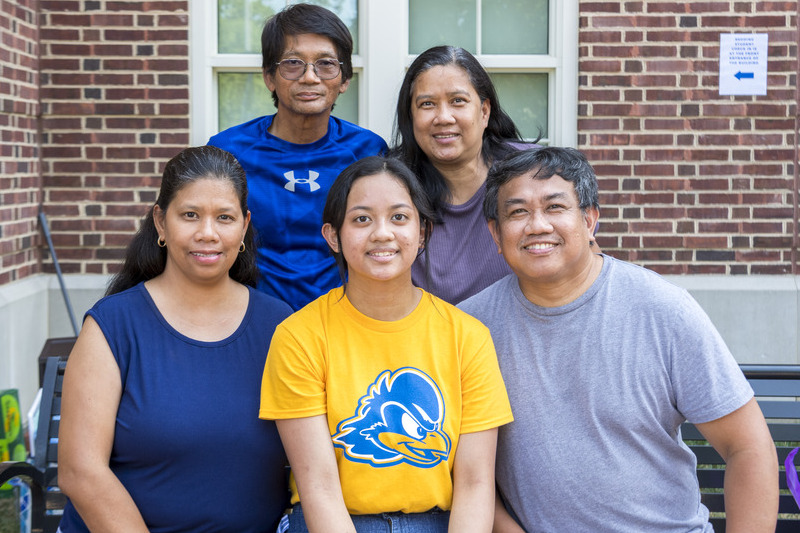 Laura Garcia (center), a first-year student from Dover, Delaware, moved into her room early so that she could help other students move into residence halls on the big day. Just three days later, her family members came to visit her. 