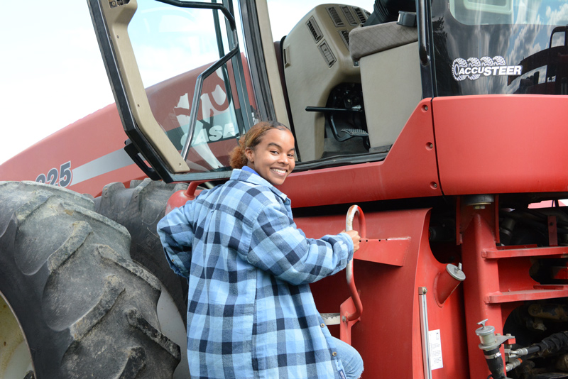 Sydney Tankard climbs aboard a Steiger tractor equipped with unique precision agriculture technology. Sydney Tankard climbs aboard a Steiger tractor equipped with unique precision agriculture technology.