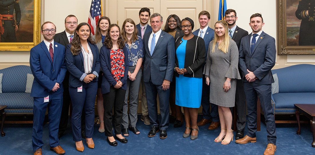 The 2019 Legislative Fellows, pictured left to right, Davis Braun, Brett Swan, Natalie Criscenzo, Meghan Mullennix, Maria Faiola, Christine Hoh, Peter Saffos, Governor John Carney, Adriante Carter, Wanja Thuku, Gerard Weir, Sophia Vassar, Nicholas Konzelman, and Eric Hastings.