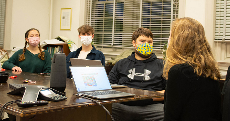Climate Scholars Maya Feinstein (left), Jackson Venness (center), and Josh Gardiner (right) listen to a presentation on water security issues during their weekly gathering.
