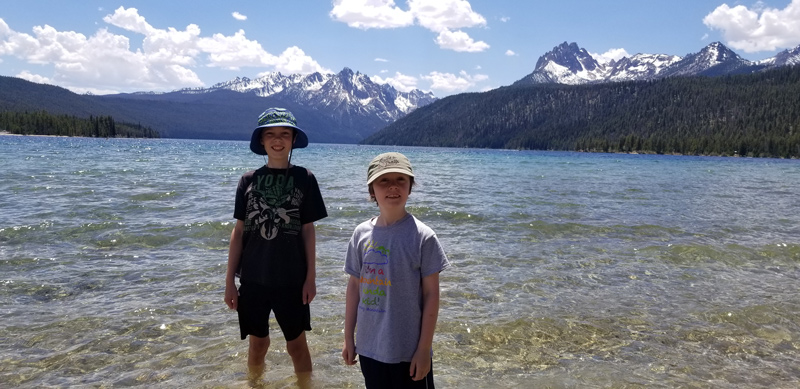 Gavyn (left) and Zach Willard stood in the crystal clear water of Redfish Lake in Stanley, Idaho, in the heart of the Sawtooth Wilderness.  