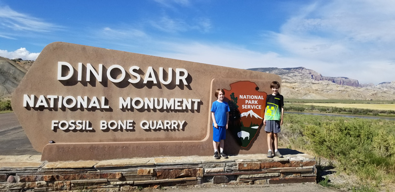 Zach (left) and Gavyn Willard toured the Dinosaur National Monument located at the border of Utah and Colorado, where prehistoric bones are still visibly embedded in canyon surfaces. 