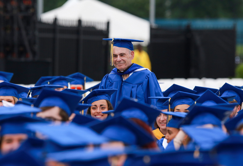 Eighty-years old, Steven Goodhart stands among the graduates at the University of Delaware College of Arts and Sciences Convocation on May 27, 2022. 