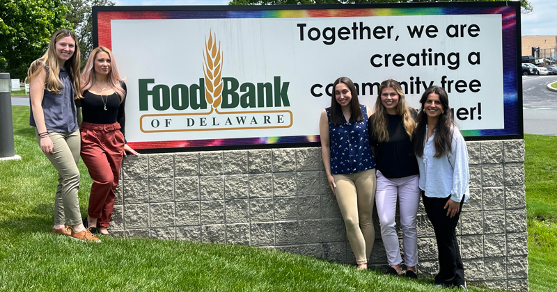Nutrition and Dietetics graduate students (L to R) Holly Delagrange, Dani Keenan, Lauren Naumann, Hannah Rater, Abigail Malle presented a community needs assessment and made recommendations to the Food Bank of Delaware as part of the organization’s desire to provide more culturally relevant foods. Nutrition and Dietetics graduate students (L to R) Holly Delagrange, Dani Keenan, Lauren Naumann, Hannah Rater, Abigail Malle presented a community needs assessment and made recommendations to the Food Bank of Delaware as part of the organization’s desire to provide more culturally relevant foods.